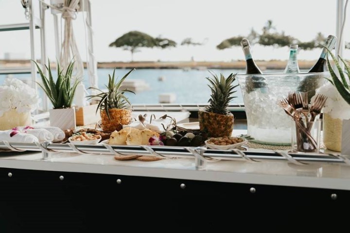 a vase of flowers on a table next to a window