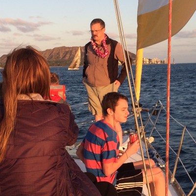 a person standing next to a body of water