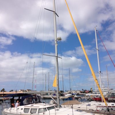 a boat is docked next to a body of water