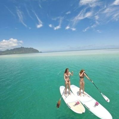 a man riding a wave on top of a body of water