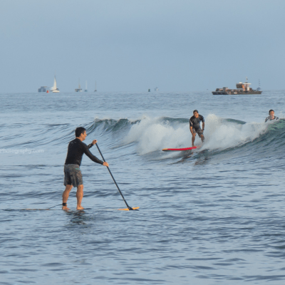 a group of people riding skis on a body of water