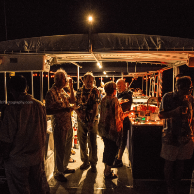 a group of people standing in a dark room