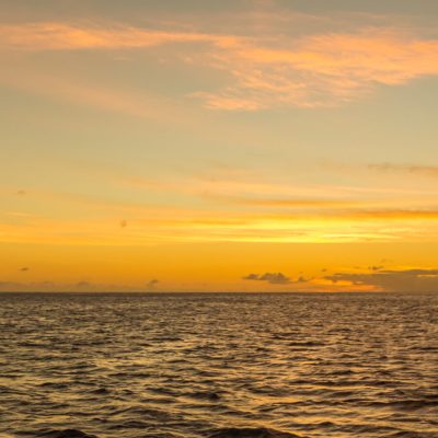 a sunset over a body of water