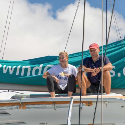 a man standing in front of a boat