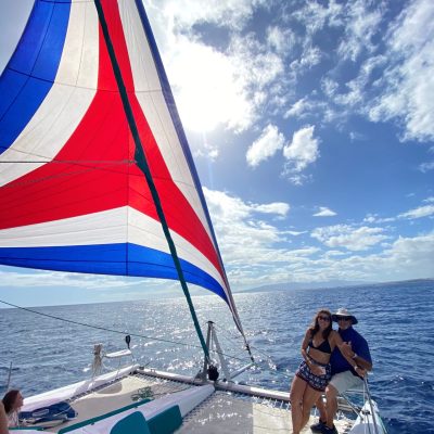 a group of people flying kites on a beach